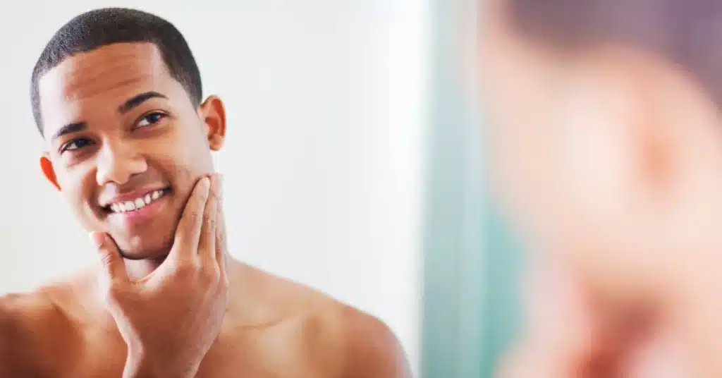 Man achieving irritation-free shave", "Close-up of irritation-free shaving products