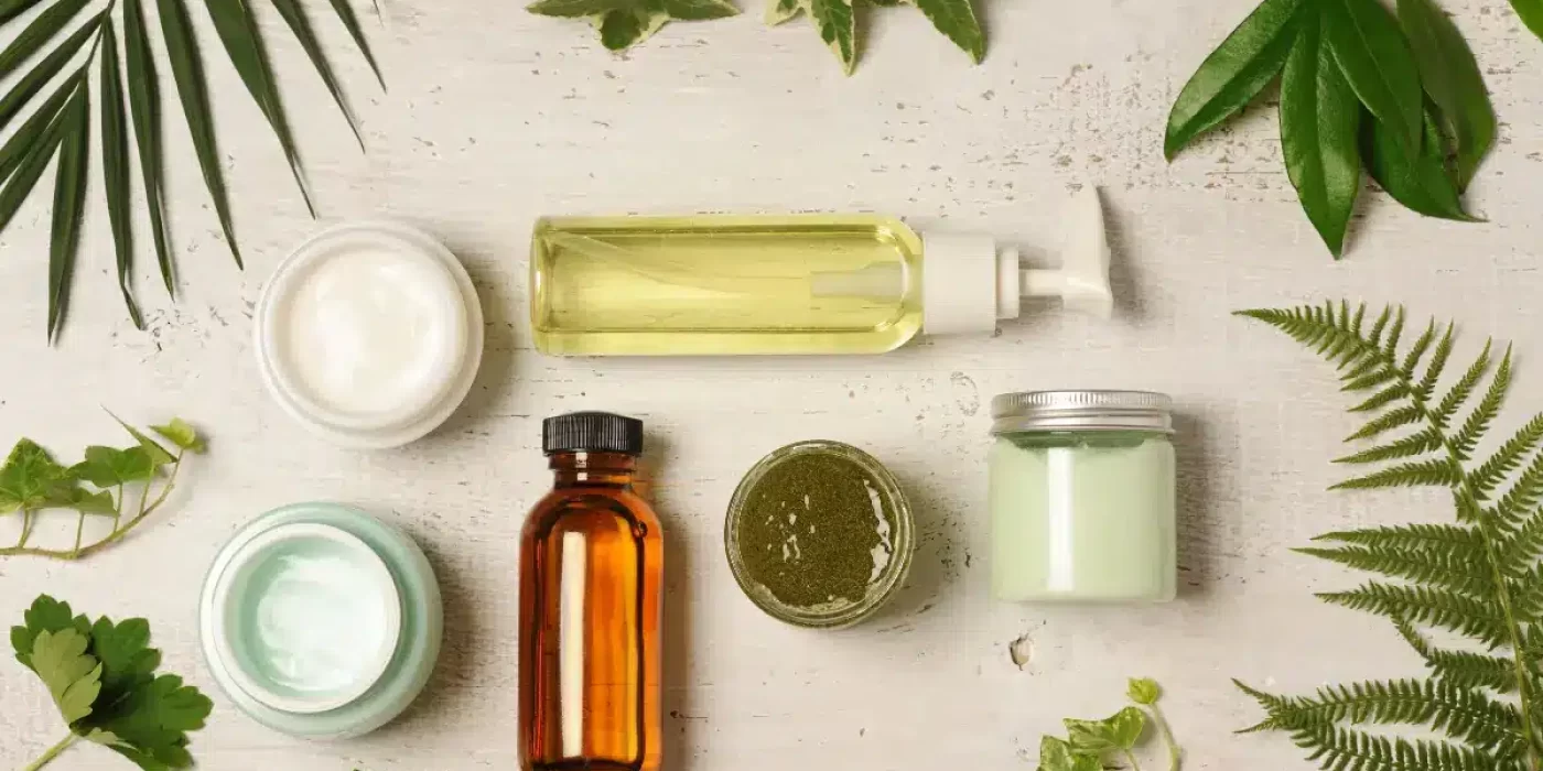 A close-up image of various natural ingredients used in shave oil, such as olive oil, grape seed oil, and rosemary extract.